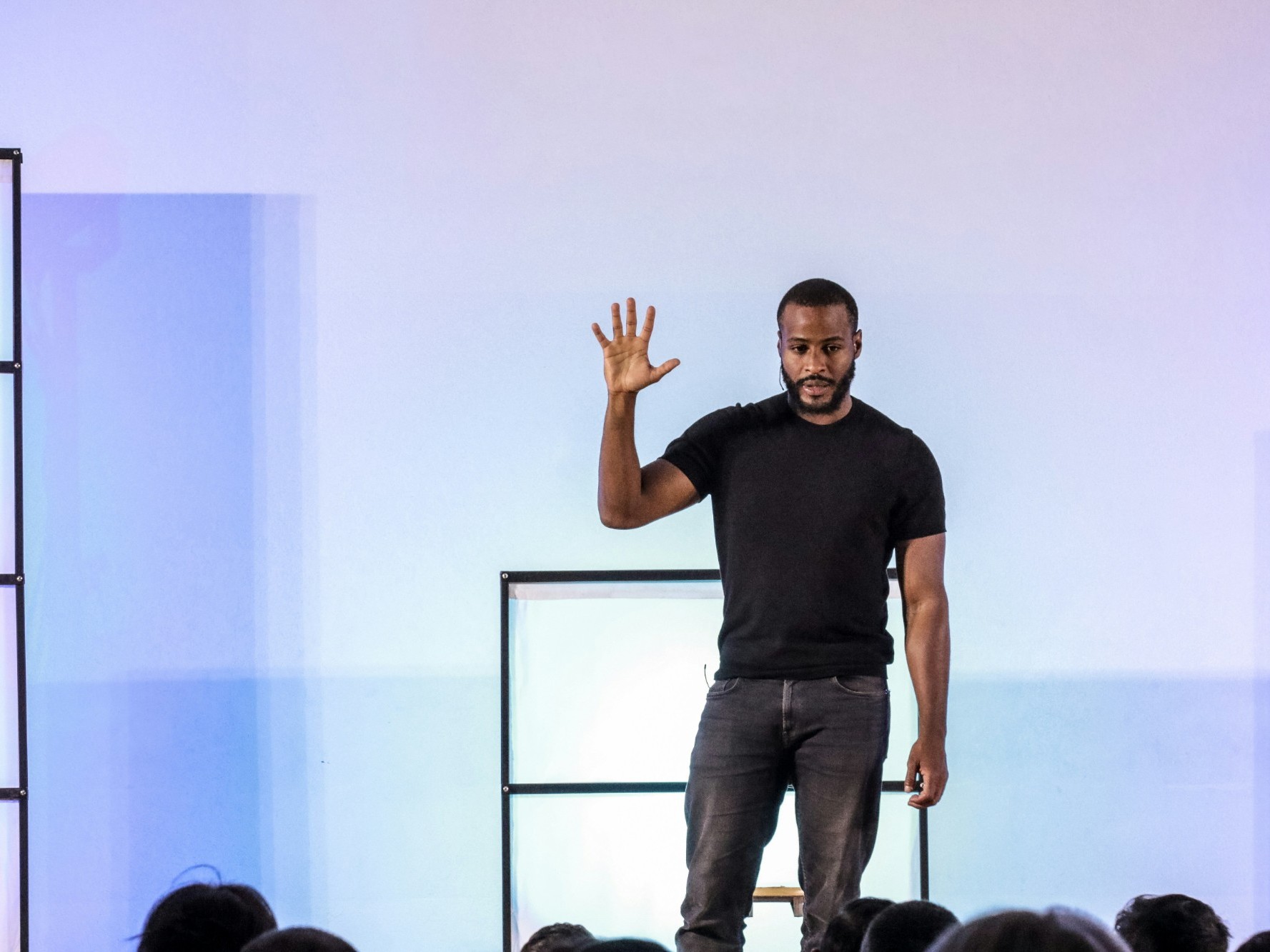 A coach speaking and engaging with an audience